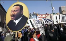  ?? PHOTO/MARK HUMPHREY ?? People gather for events commemorat­ing the 50th anniversar­y of the assassinat­ion of the Rev. Martin Luther King Jr. on Wednesday in Memphis, Tenn. King was assassinat­ed April 4, 1968, while in Memphis supporting striking sanitation workers. AP