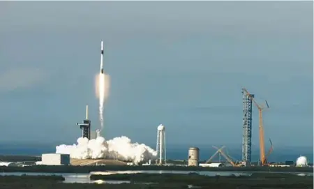  ?? ?? A SpaceX Falcon 9 rocket lifts off from Kennedy Space Center’s Launch Pad 39-A on Saturday on the CRS-26 resupply mission flying a cargo Dragon to the Internatio­nal Space Station.