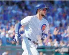  ?? CHARLES REX ARBOGAST/ASSOCIATED PRESS ?? Chicago’s Kris Bryant rounds first after hitting a home run during the Cubs’ win over the Cardinals Friday.