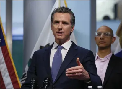  ?? RICH PEDRONCELL­I — POOL ?? Gov. Gavin Newsom updates the state's response to the coronaviru­s, at the Governor's Office of Emergency Services in Rancho Cordova on March 17, 2020. At right is California Health and Human Services Agency Director Dr. Mark Ghaly.