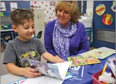  ?? Photo by Katharine Lotze/The Signal ?? Jackie Hartmann, executive director of the SCV Education Foundation, sits down for the camera with Wiley Canyon Elementary kindergart­en student Jude Rumbaugh, 5, to talk about a Lego Star Wars book that will be part of the Bag-o-Books program starting...