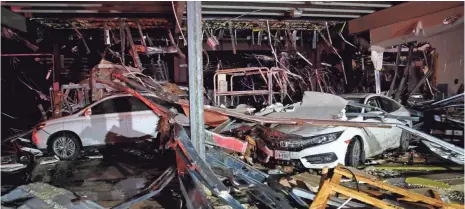  ?? TOM FOX, THE DALLAS MORNING NEWS, VIA AP ?? Walls collapsed at the I-20 Dodge dealership Saturday near Canton, Texas, after tornadoes swept through the area.