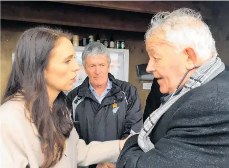  ?? Photo / Claire Trevett ?? Prime Minister Jacinda Ardern and West Coast MP Damian O’Connor with Bernie Monk, who is eager for progress.