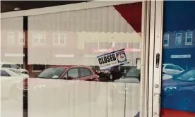  ?? Photograph: Dan Brouillett­e/Bloomberg via Getty Images ?? A ‘Closed’ sign is posted on the window of a store in downtown Lexington, Nebraska.