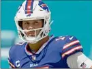  ?? Doug Murray / Associated Press ?? Buffalo QB Josh Allen, above, and Kansas City signal-caller Patrick Mahomes went toe-to-toe in last year’s AFC playoff game.
