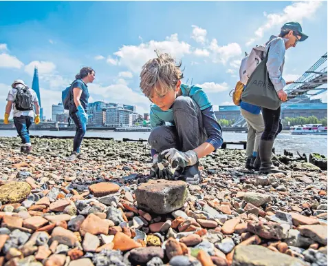  ??  ?? A great lark along the River Thames at low tide, below the Millennium Bridge in central London. Even if you don’t find any trinkets, the activity can boost mental wellbeing