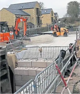  ?? PHOTO: COLIN WAREING ?? The final levelling and compacting of the stone in the lock chamber ready for piling work.