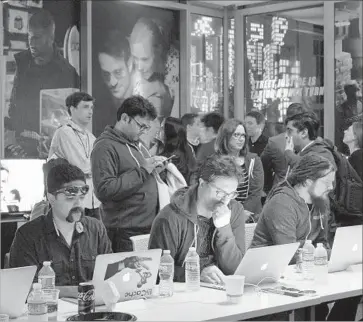  ?? Glenn Chapman AFP/Getty Images ?? NETFLIX and other streaming companies have never publicly revealed the sizes of their audiences for specific programs. Above, Netf lix staff prepare for the launch of the second season of the “Daredevil” series in March.