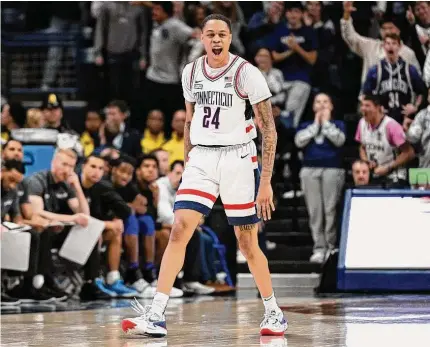  ?? Jessica Hill/Associated Press ?? UConn’s Jordan Hawkins reacts after making a 3-point basket in the second half against Seton Hall on Feb. 18 in Storrs.