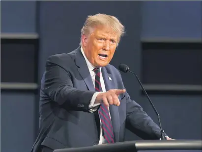  ?? PATRICK SEMANSKY — THE ASSOCIATED PRESS ?? President Donald Trump gestures while speaking during the first presidenti­al debate Tuesday, Sept. 29, 2020, at Case Western University and Cleveland Clinic, in Cleveland, Ohio.