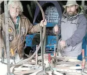  ?? Picture: SUPPLIED ?? ARTISTRY: Basil Mills and son Steven prepare a wagon wheel for shodding.