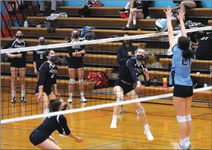  ?? Photos by Ernest A. Brown ?? Burrillvil­le senior outside hitter Paige McCreight delivers a kill early in the Broncos’ five-game defeat to Johnston Wednesday night. The defeat dropped the Broncos to 1-1 in Division II.
