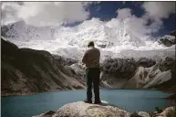  ?? Angela Ponce / For The Washington Post ?? Saul Luciano Lliuya, a Peruvian farmer and mountain guide who filed a lawsuit against the German electricit­y consortium RWE, visits lake Palcacocha in Huaraz, Peru, on May 23.