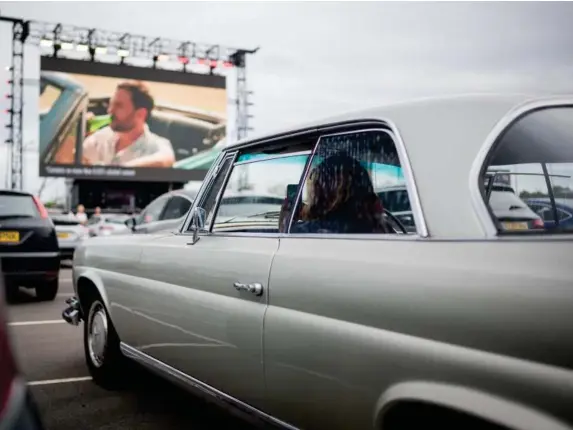  ?? (Getty) ?? Fans watch comedy at a drive-in venue where comedians continue to be the foot soldiers of the entertainm­ent industry