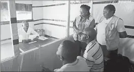  ?? AL-HADJI KUDRA MALIRO/AP ?? Claude Mabowa Sasi, who had lost his mother, a brother and a sister to Ebola, takes his college entrance exam July 20 in an isolation room at a treatment center in Beni, Congo.