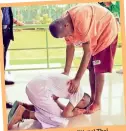  ??  ?? a traditiona­l Thai To show respect, using on the floor to kowtow gesture, the boy knelt at his father’s feet