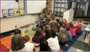  ?? PHOTO PROVIDED ?? Students at West Sand Lake Elementary listen to a member of the military and create care packages for military members.