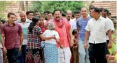  ??  ?? President Rajapaksa, his sons and supporters trekking to the polling booth at Medamulana. Pic by Rahul Samantha Hettiarach­chi