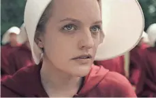  ?? HULU ?? The Handmaid’s Tale, starring Elisabeth Moss as Offred, is an original drama series on Hulu that won the streaming service five Emmys last month.