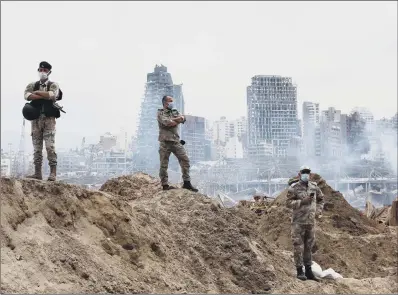  ?? PICTURE: THIBAULT CAMUS/AFP/GETTY IMAGES ?? AFTERMATH: Lebanese soldiers at the site of the massive explosion in the port of the capital Beirut.