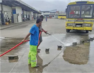  ??  ?? Nausori Town Council workers cleaning the bus stand.