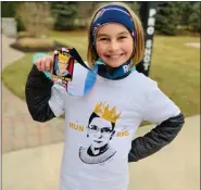  ?? PHOTOS COURTESY OF TROY SCHOOLS AND THE SPANGLER FAMILY ?? Fifth-grader Lucy Spangler after taking part in the virtual “Run for RBG” 5K.
