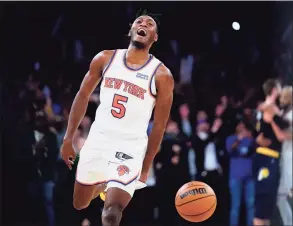  ?? Frank Franklin II / Associated Press ?? The Knicks’ Immanuel Quickley (5) celebrates after beating the Pacers 92-84 on Monday night in New York.