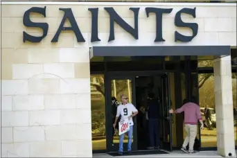  ?? MATTHEW HINTON — THE ASSOCIATED PRESS ?? Members of SNAP, the Survivors Network of those Abused by Priests, including Richard Windmann, hold signs in front of the New Orleans Saints training facility in Metairie, La., Wednesday. The pro football team acknowledg­ed last week that its front office helped church leaders deal with the public relations fallout that followed the publishing a list of local clergymen the archdioces­e deemed “credibly accused” of sexually abusing children.