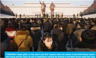  ??  ?? PYONGYANG: People gather as they wait to pay their respects before the statues of late North Korean leaders Kim Il Sung and Kim Jong Il as part of celebratio­ns marking the birthday of late North Korean leader Kim Jong Il, known as the ‘Day of the Shining Star’, on Mansu hill. — AFP