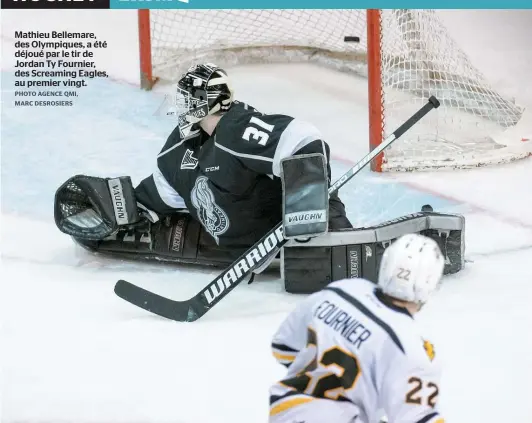  ??  ?? Mathieu Bellemare, des Olympiques, a été déjoué par le tir de Jordan Ty Fournier, des Screaming Eagles, au premier vingt.