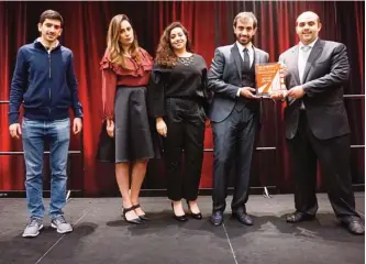  ??  ?? Alghanim Industries’ team is pictured with the conference’s organizers.