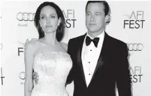  ?? FILE PHOTO BY RICHARD SHOTWELL/INVISION VIA AP ?? Angelina Jolie and Brad Pitt arrive at the 2015 AFI Fest opening night premiere of “By The Sea” in Los Angeles. Jolie Pitt said she wants her divorce from Brad Pitt finalized before the end of the year and that she intends to seek retroactiv­e child...