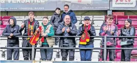  ?? ?? Cheering on the team A group of Rovers fans backing their side in Linlithgow