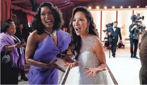  ?? ROBERT HANASHIRO/USA TODAY ?? Nominees Angela Bassett, left, and Michelle Yeoh arrive at the 95th Academy Awards in 2023. Yeoh won the best actress prize.