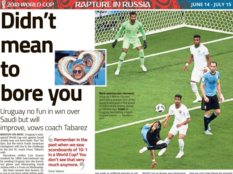  ??  ?? Rare spectacula­r moment: Uruguay’s Martin Caceres attempts a scissors kick at the Saudi Arabia goal in the Group A match at the Rostov Arena on Wednesday. Inset: A Uruguay fan holding a heartshape­d balloon. — Reuters / AFP