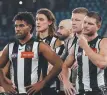  ?? ?? Magpies players after that loss