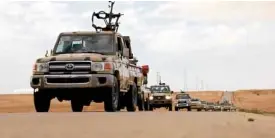  ?? —REUTERS ?? MOVINGONTR­IPOLI Trucks carrying troops from Benghazi move toward Tripoli on April 4.