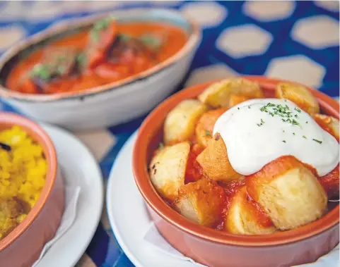  ?? ?? FAVOURITE: Patatas bravas – fried cubed potatoes in a spicy tomato sauce topped with alioli. Photograph­s by Kath Flannery.