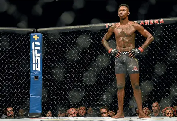  ?? GETTY IMAGES ?? Israel Adesanya beat Paulo Costa at UFC 253 to cement his status as the sport’s ‘‘next big superstar’’ and gave up his first-class seat on the plane.