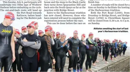  ??  ?? Athletes awaiting the start of last year’s Harbourman triathlon.
