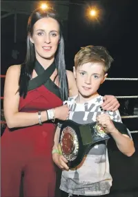  ??  ?? Tyler Whyte receives the Bryan Whyte Memorial Belt for Young Boxer of the Season from his mother, Dawn Gordon. The belt was presented to the club in memory of Tyler’s father. Photograph­s: Alba Photos.