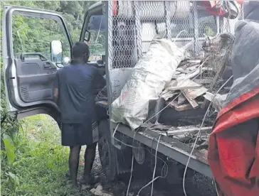  ?? Photo: Deptfo News ?? A Ministry of Forests official caught a man with a truck, registrati­on number EE253 throwing rubbish along the Colo-i-Suva Forest Park on Friday, February 15, 2019.
