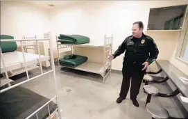  ??  ?? SGT. STEVE BOWLES, who runs Seal Beach’s jail, says the facility tries to make sure inmates’ basic needs are met. “But ... it’s still a jail,” he says.