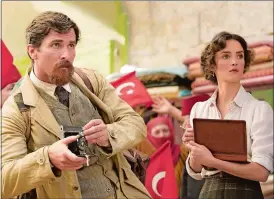  ?? JOSE HARO/OPEN ROAD FILMS VIA AP ?? Christian Bale (shown with Charlotte Le Bon, right) portrays a journalist in “The Promise.”