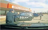  ?? [OKC] ?? An image captured from a camera inside a police car shows Oklahoma City Police Sgt. Clifford Holman firing at Bennie Edwards as he runs away from officers. Holman was charged Thursday with first-degree manslaught­er in Edwards' death.