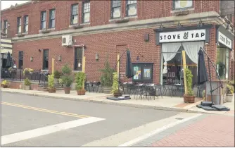  ??  ?? The borough of Lansdale worked with restaurant Stove & Tap to create an outdoor dining space.