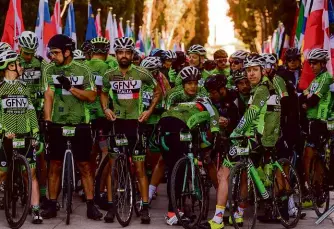  ??  ?? Above: Riders gather on the tree-lined Viale della Rimembranz­a for the start of the GFNY Italia 2019