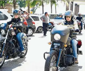  ??  ?? Riders Suhana Mislin (left) and Norcilia Omar leading a convoy of big bikers out of a hotel in Colombo.