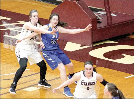  ?? Photo courtesy of Evangel University ?? John Brown University junior Baily Cameron posts up an Evangel (Mo.) University defender during Saturday’s women’s basketball game in Springfiel­d, Mo. Cameron, a former Siloam Springs standout, scored 16 points, including the 1,000th point of her JBU...