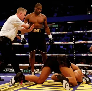  ??  ?? WRECKING MACHINES: Dubois [above] destroys Carter with brutal ease in less than a minute, while Yarde hammers Nemesapati [right] to defeat after three rounds of action